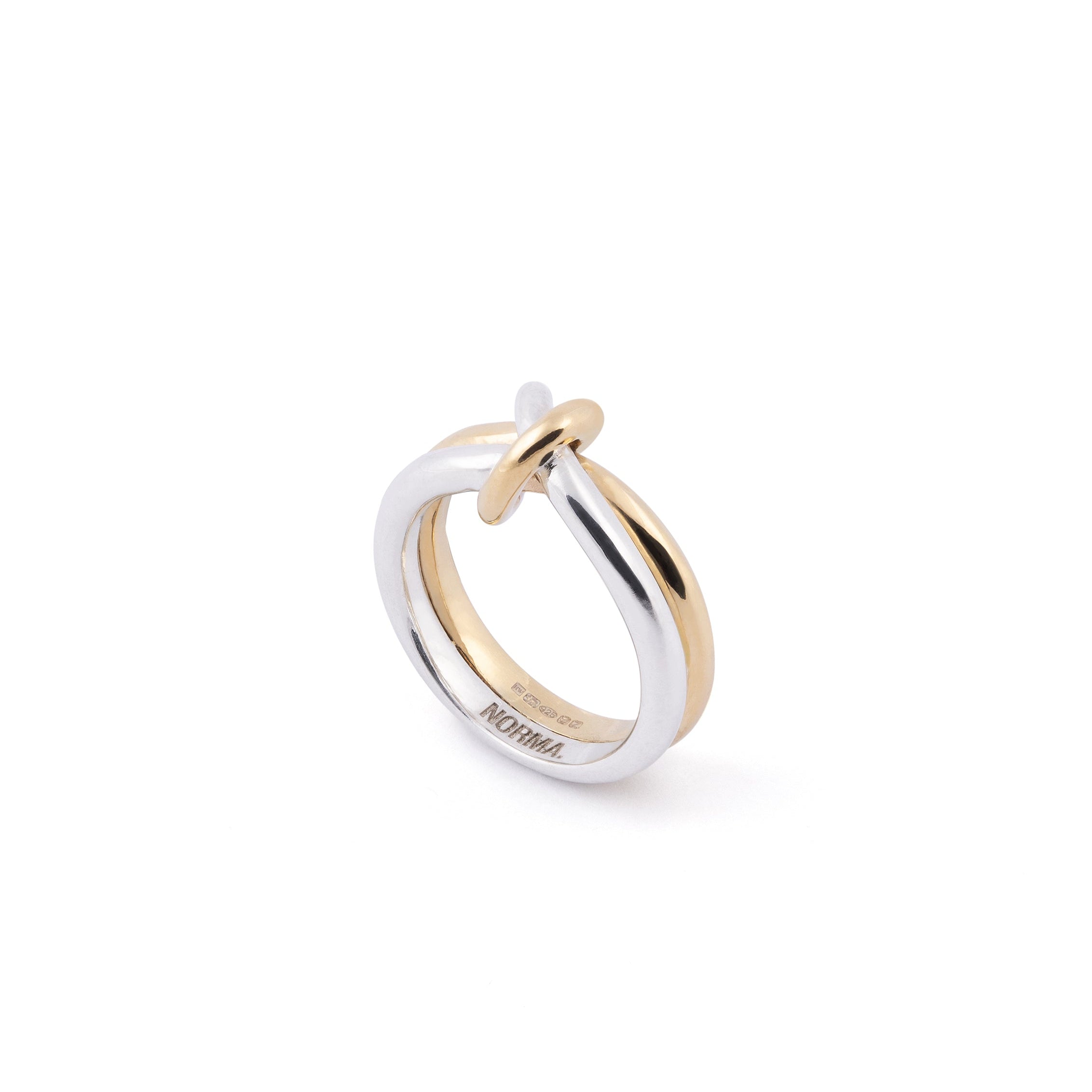 Two gold knot detail ring on a white background