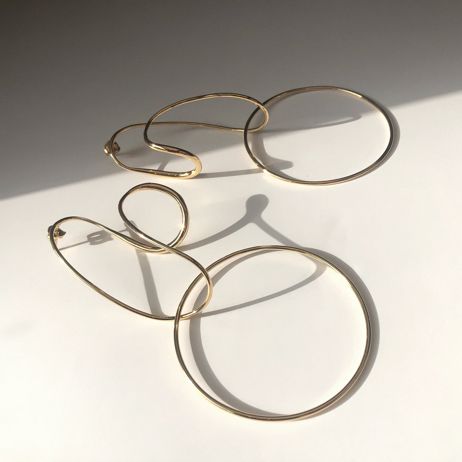 OPPOSING FORMS EARRINGS