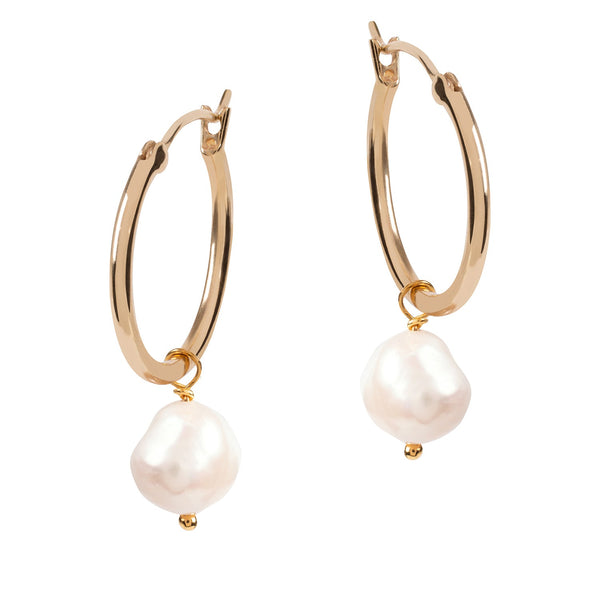 One of our all time best selling item! The perfect everyday gold hoop earrings entirely handmade with sustainable materials and available in three sizes. The white baroque pearl charm can be removed and used as a necklace pendant. Sustainable materials are 14 Carat gold vermeil – recycled sterling silver dipped in with several layers of recycled 14 Carat gold.